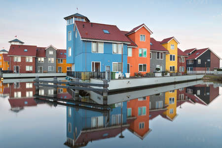 colorful buildings on water, Groningen, Netherlandsの写真素材