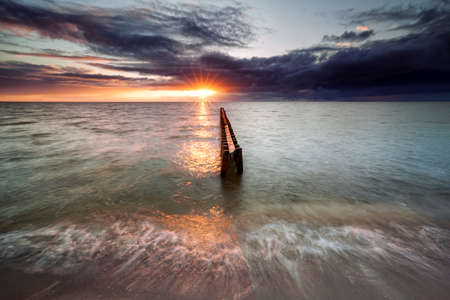 sundown on Ijsselmeer beach, Hindeloopen, Friesland, Netherlandsの写真素材