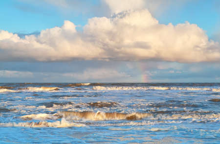 rainbow over stormy North sea, North Holland, Netherlandsの写真素材