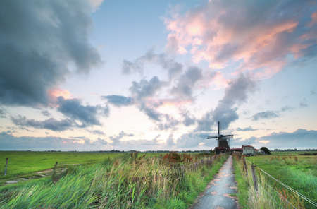bike road to Dutch windmill in the morning, Netherlands