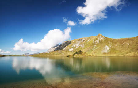 beautiful sky reflected in alpine lake Schrecksee, Germany
