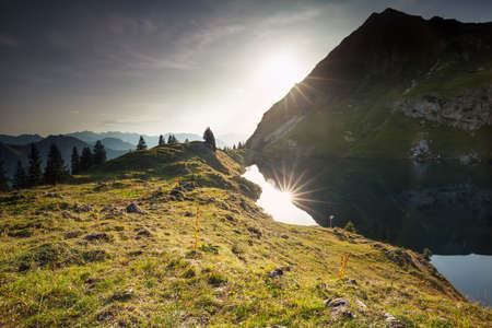 sunset over alpine lake and mountain peaks, Germanyの写真素材