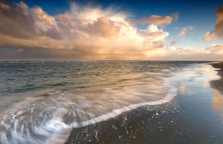 stormy sky over North sea at sunrise, Texel, Netherlands