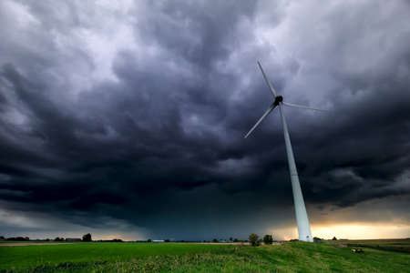 dramatic storm sky and wind turbine, Netherlandsの写真素材