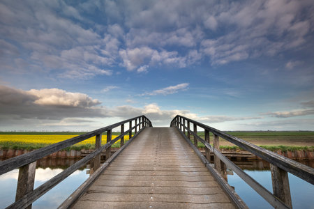 bridge over river and blue sky in countrysideの写真素材