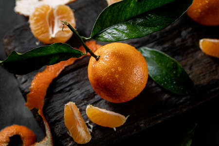 fresh juicy tangerine on boardの写真素材