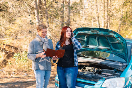 two women calling with broken down car