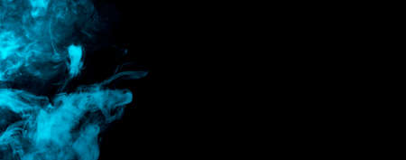 movement of a cloud of blue cigarette steam, on dark background. banner with illuminated coloured smoke.の写真素材