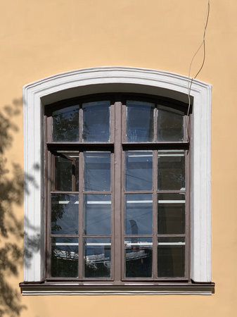 Old vintage wooden window. Historic city wall