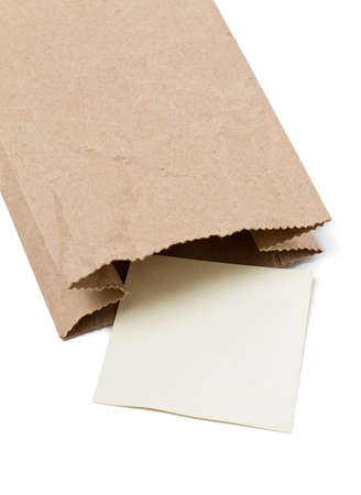 Note paper in Brown paper bag on a White Background