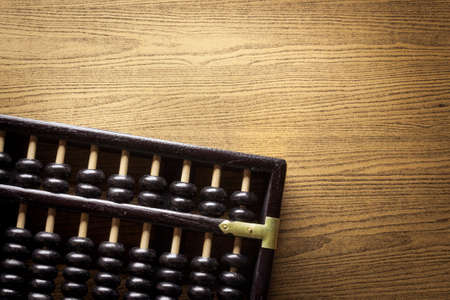 Abacus on a wooden floorの写真素材