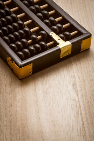 Abacus on a wooden floorの写真素材