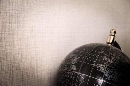 Globe black on brown backgroundの写真素材