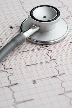 Stethoscope on the ECG. medical symbolic close-up photo