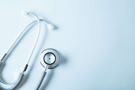 Stethoscope on blue background