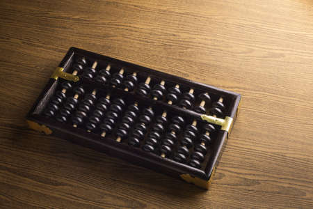 Abacus on a wooden floorの写真素材