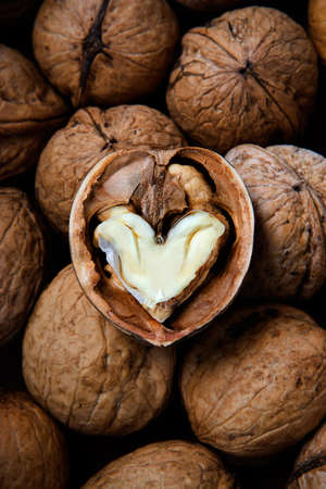 The cracked walnut with heart-shaped coreの写真素材