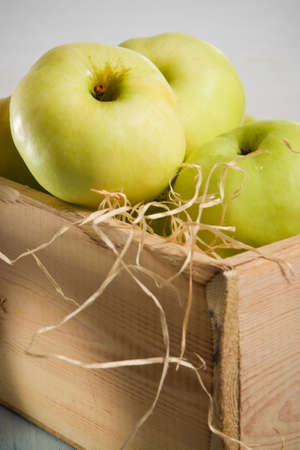 Green apples in the  wooden boxの写真素材