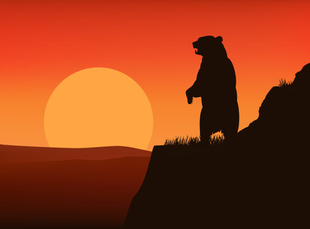 brown bear rearing up on high cliff at sunset - horizontal vector silhouette view of copy space dramatic wilderness scene with standing wild animalのイラスト素材