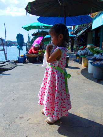 Cute little girl at the beachの写真素材