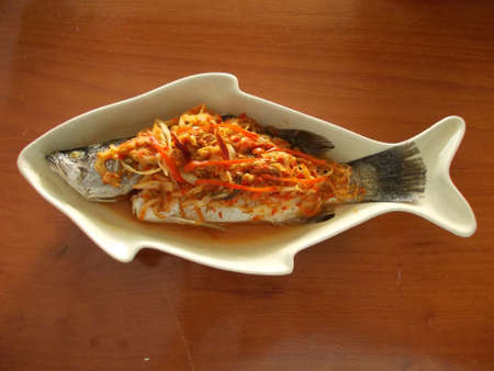 Steamed fish with lemon and garlicの写真素材