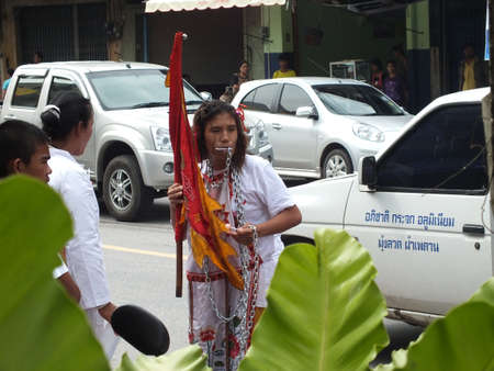 Nakhon si thammarat, Thailand - October 20, 2012 - Unidentified Thai men to be incarcerated with spirits in Chinese Vegetarian Festival parade on October 20, 2012 in Nakhon si thammarat, Thailand.のeditorial素材