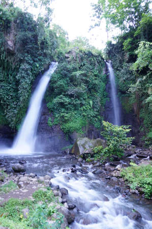 Tirto Pengantin Waterfall is one of the natural tourism destinations in Banyuwangi Regency, the source of water from this waterfall is from Raung Mountain.の写真素材