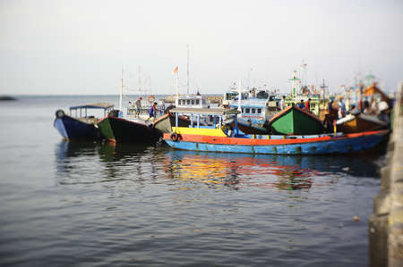 Traditional fishing vessels that still use traditional fishing gear, this boat is made of wood that is resistant to sea water. Fishing boats dock at the seashore.の写真素材