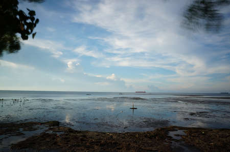 sunrise or sunset on the beachの写真素材