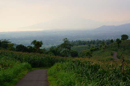 paved roads on hills or highlands connect the two villagesの写真素材