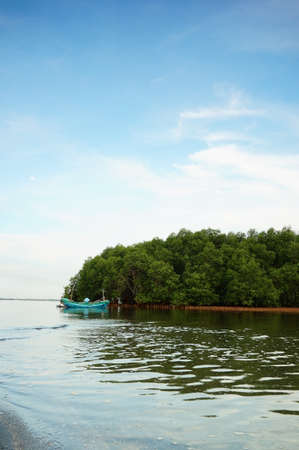fishing boat leaning against the pierの写真素材