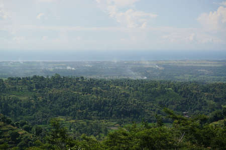 valley and forest landscapes seen from the hillsの写真素材