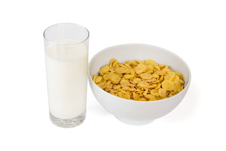 Milk glass and corn flakes in a bowl