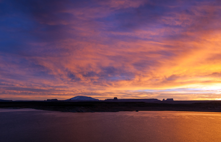 Beautiful classic sunrise over hills and lakeの写真素材
