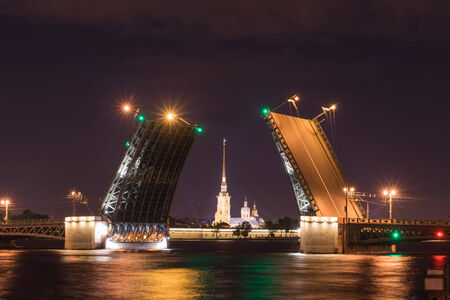 Open drawbridge at night in St. Petersburg Russiaの写真素材