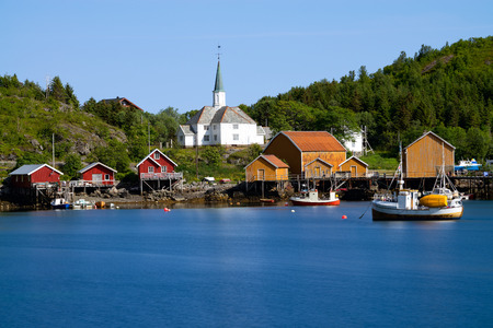 panorama of fishing town Reine and surrounding fjords on Lofoten islands in Norway, famous tourist destinationの写真素材