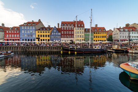 Nyhavn harbour was once the sailors quarter and the home of Hans Christian Andersen. It's colourful buildings are filled with cafes, bars, jazz clubs and tourists visiting Copenhagen.のeditorial素材