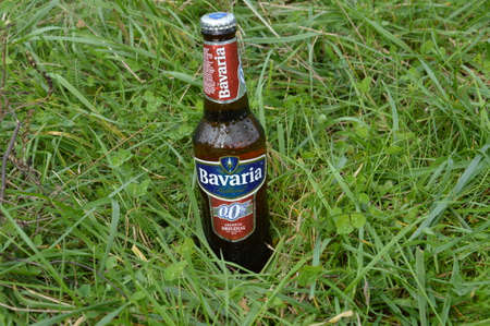 Bottle of non alcoholic beer in nature is Bavaria beer  of Hollandのeditorial素材