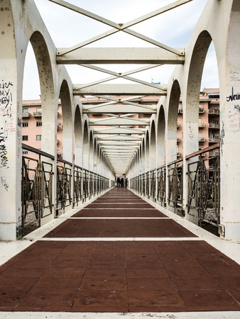 Civitavecchia, Italy - March 29, 2015: at sunset, some people walking on the old dock of the seafront in Civitavecchia.のeditorial素材