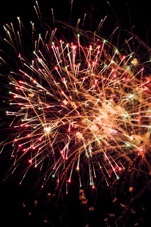 Close-up of colorful fireworks in the sky at nightの写真素材