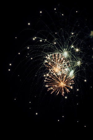 Close-up of colorful fireworks in the sky at nightの写真素材
