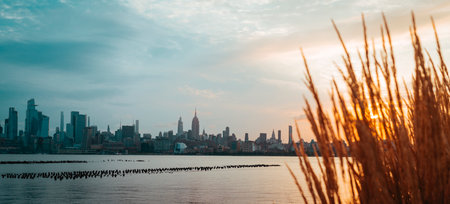 sunset over the river views the manhattanの写真素材