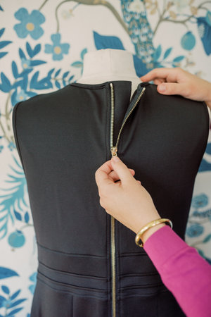 Gold zipper on black pumping dress on bust is zipped up.の写真素材