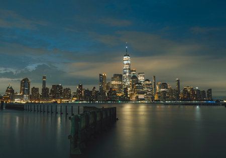 city skyline Manhattan sky clouds lights water river New Yorkの写真素材