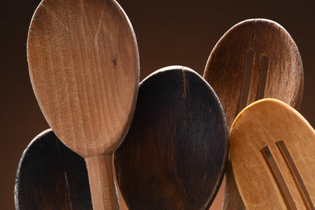 A few used wooden cooking spoonsの写真素材
