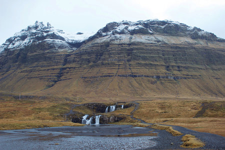 Waterfall neat Kirkjufell mountain in Icelandの写真素材
