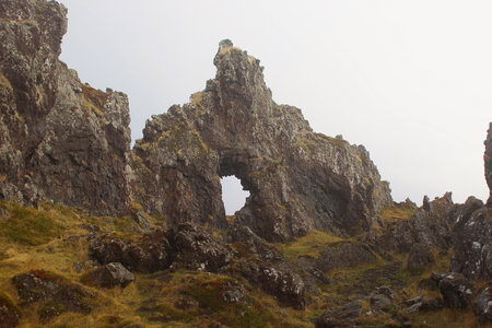Unusually shaped rock covered with mossの写真素材