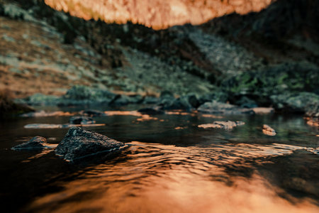 River crossing a valley with a mountain in the backgroundの写真素材