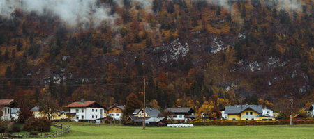 houses surrounded by mountains of Austriaの写真素材