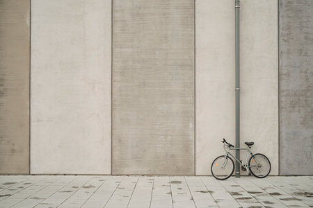 Bicycle parked near modern buildingの写真素材